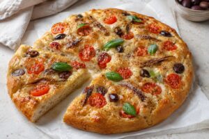 Focaccia con pomodorini e acciughe in friggitrice ad aria